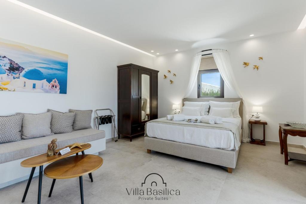 a white bedroom with a bed and a couch at Villa Basilica Tefsia in Perivolos