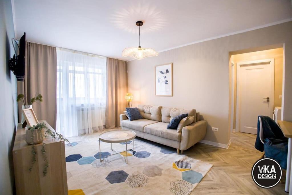 a living room with a couch and a table at Bulevard Apartments 11 in Alba Iulia