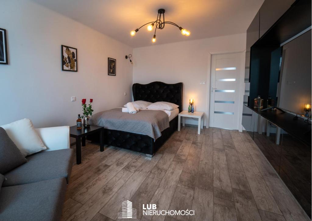 Posteľ alebo postele v izbe v ubytovaní Apartament Nero