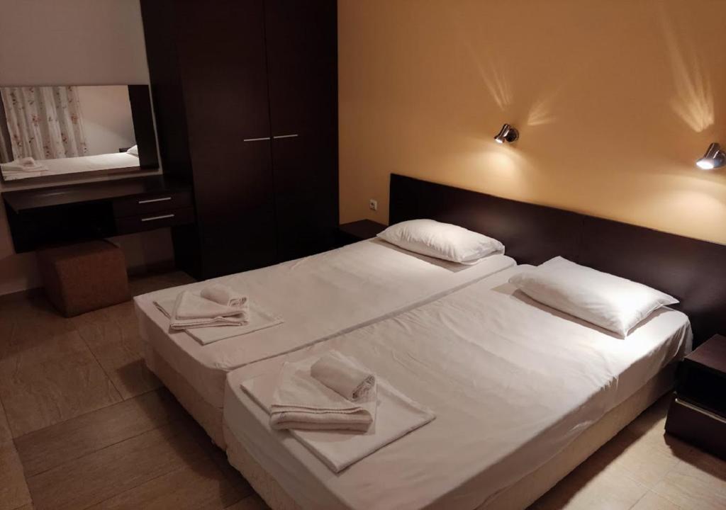 a bedroom with a bed with two towels on it at Kims One-bed Apart for rent at Sunny Beach Resort in Sunny Beach
