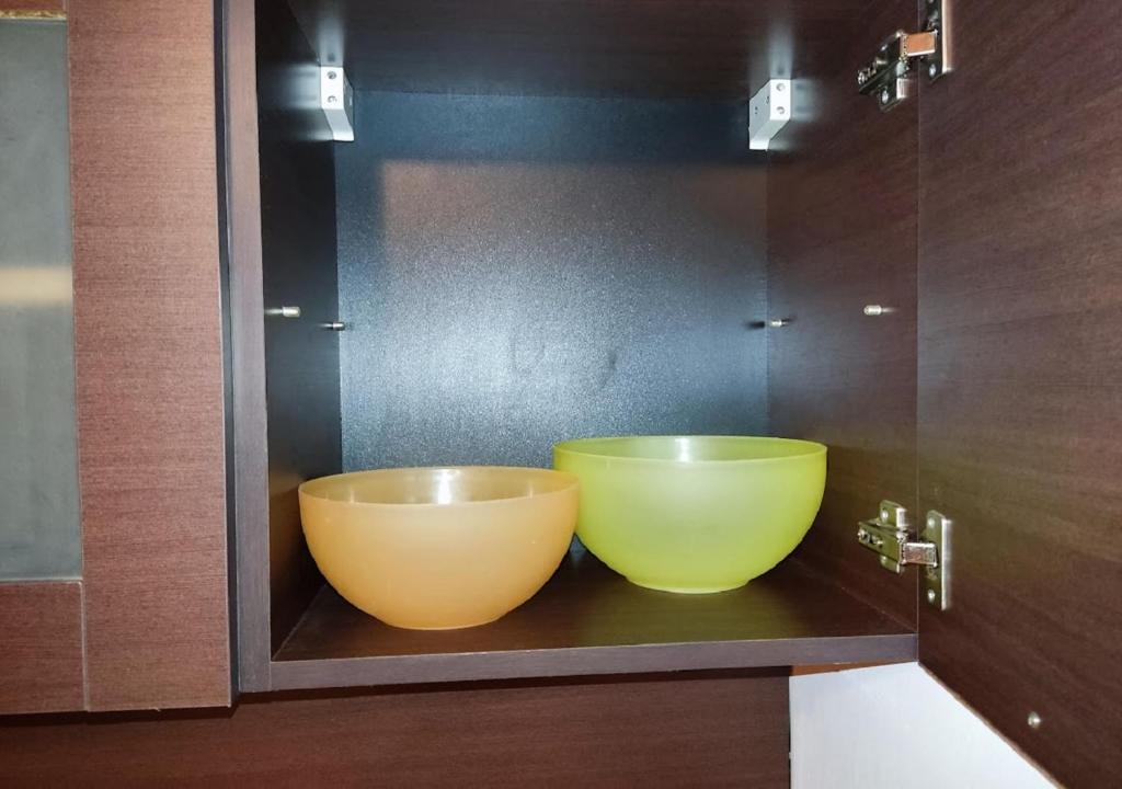 two large bowls sitting on a shelf in a bathroom at Kims One-bed Apart for rent at Sunny Beach Resort in Sunny Beach