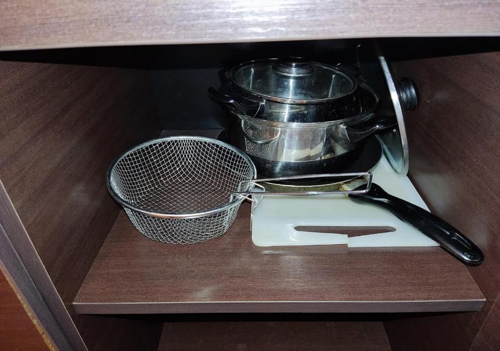 a whisk and a strainer sitting on a shelf at Kims One-bed Apart for rent at Sunny Beach Resort in Sunny Beach