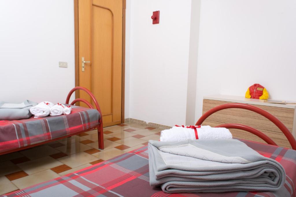 A bed or beds in a room at Agrigento CityCenter