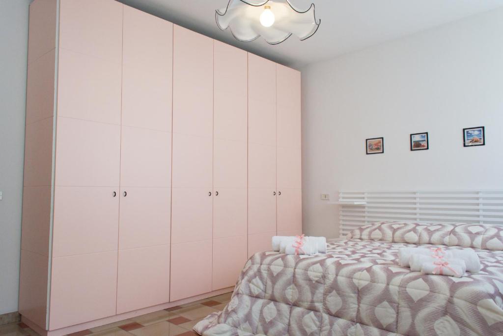 A bed or beds in a room at Agrigento CityCenter