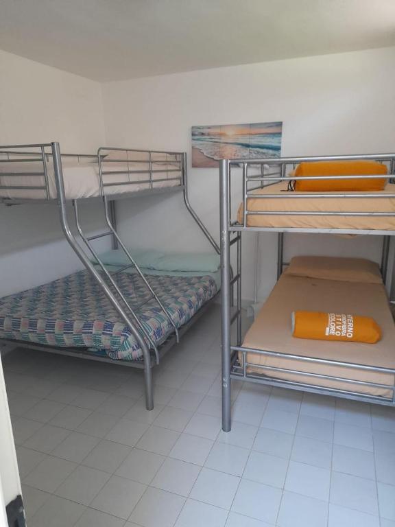 Postel nebo postele na pokoji v ubytování Casamarina Orchidea