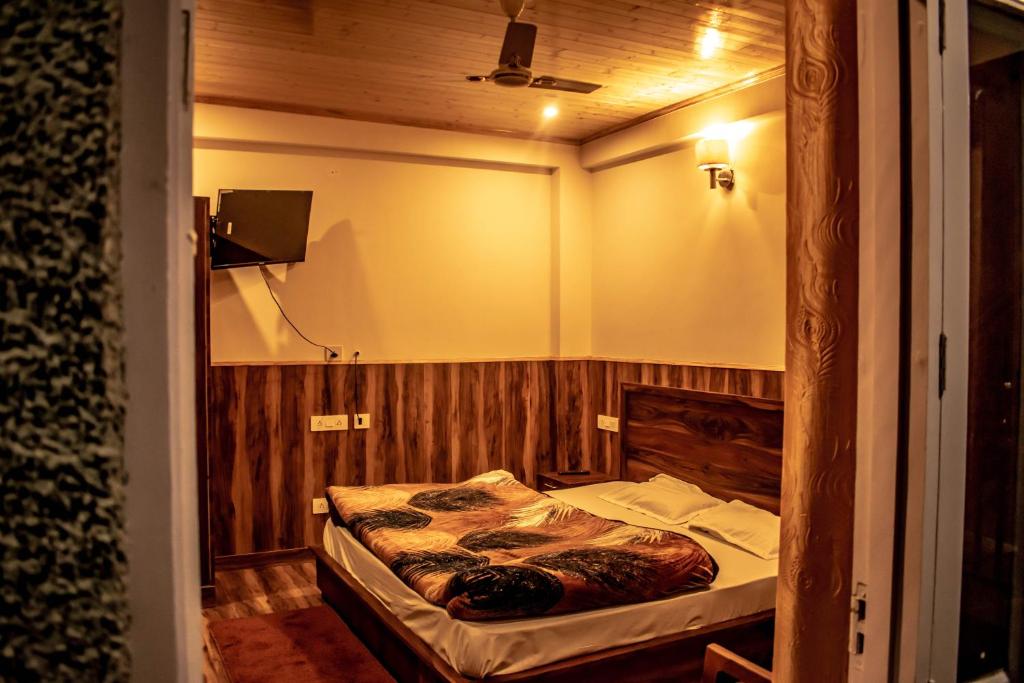 Katil atau katil-katil dalam bilik di Gayatri Lodge
