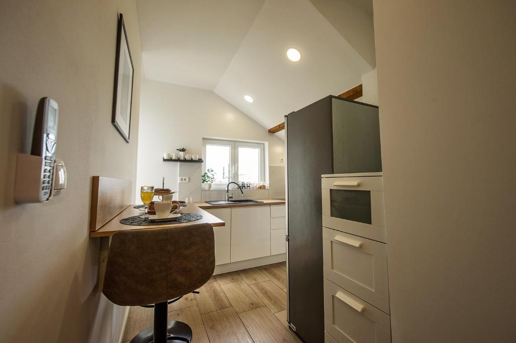 Kuchyň nebo kuchyňský kout v ubytování Apartman I & J
