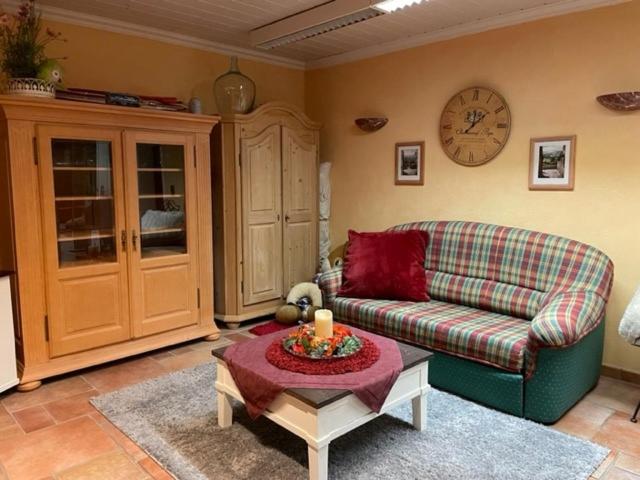 a living room with a couch and a table at Ferienwohnung Le Paradis in Bad Ems