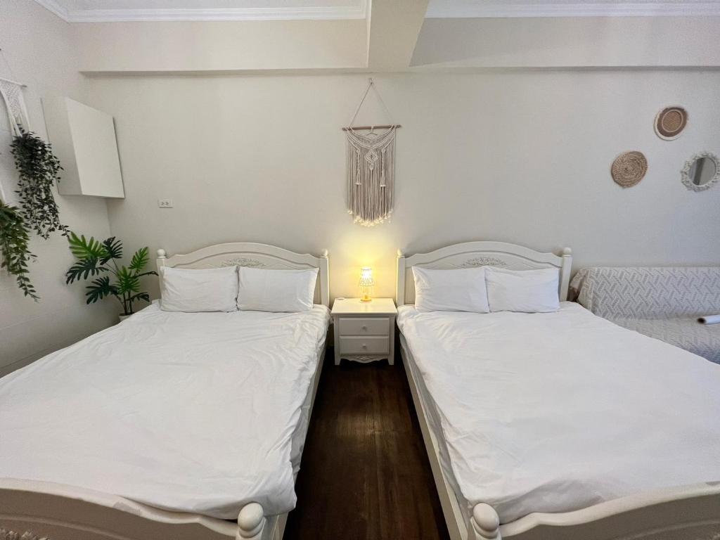 Postel nebo postele na pokoji v ubytování 海沐輕旅 Sea Mu Kenting