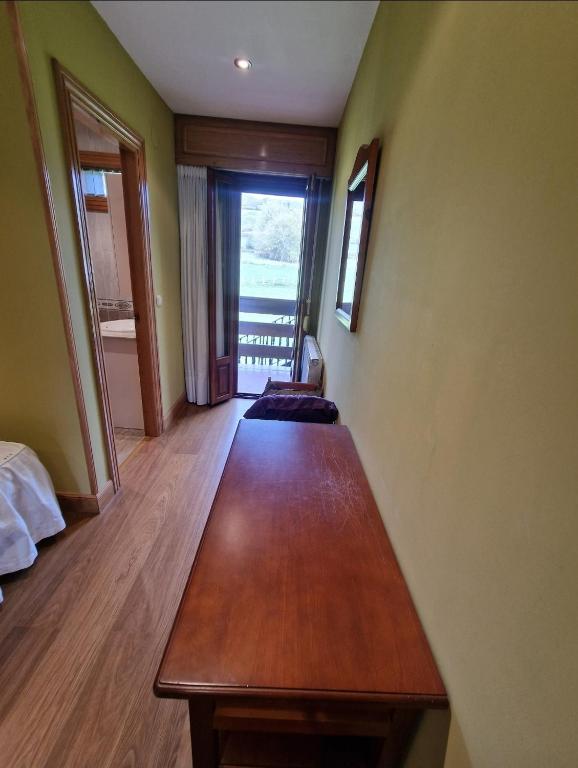 Postel nebo postele na pokoji v ubytování Hostal Lizuniaga