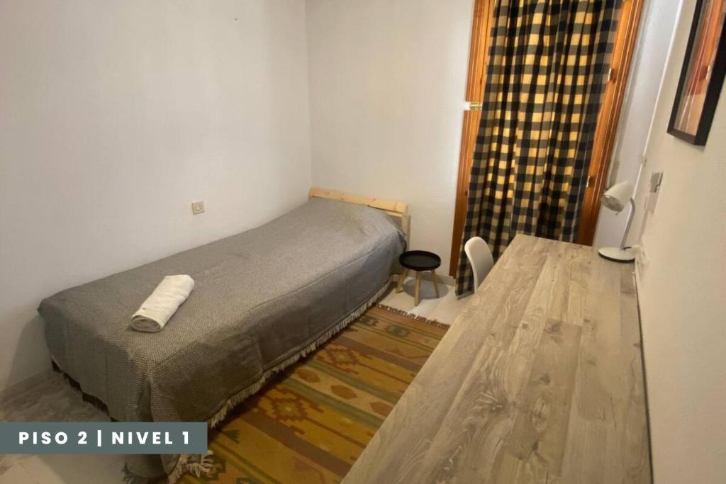 Posteľ alebo postele v izbe v ubytovaní Pisos Baza, Tres apartmentos en Baza Central