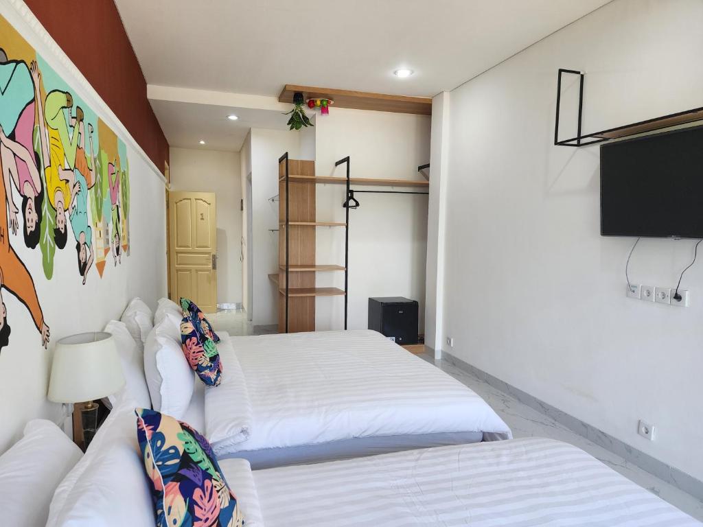 Postel nebo postele na pokoji v ubytování Hepi Yuk Ubud Luxury Guesthouse