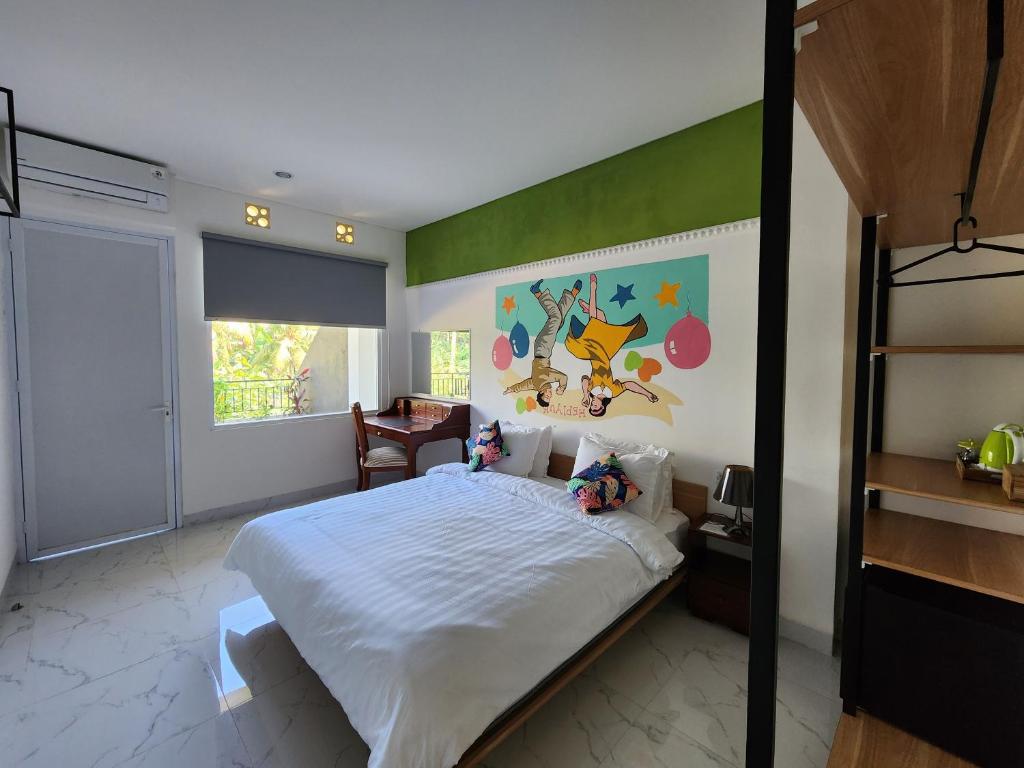 Postel nebo postele na pokoji v ubytování Hepi Yuk Ubud Luxury Guesthouse