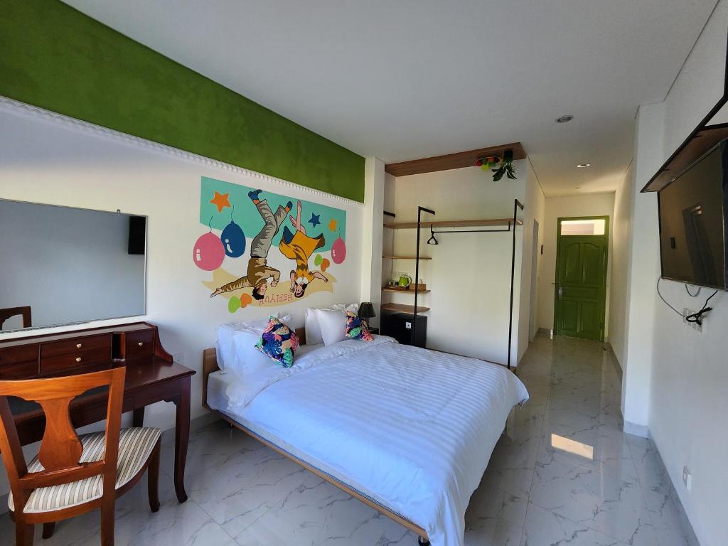 TV a/nebo společenská místnost v ubytování Hepi Yuk Ubud Luxury Guesthouse