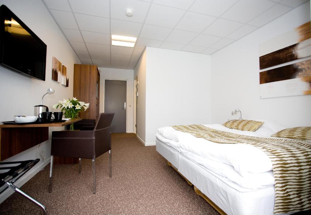 Postel nebo postele na pokoji v ubytování Hotel Thinggaard