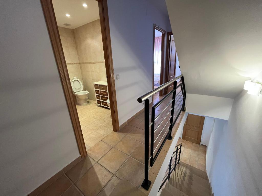 A bed or beds in a room at Adosados Palm Beach Altamar