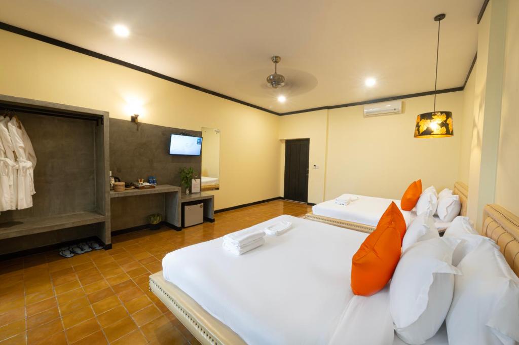 Postel nebo postele na pokoji v ubytování Sophavady D'Angkor