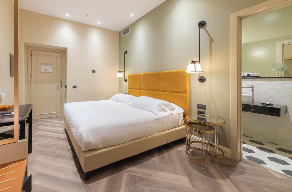 Postel nebo postele na pokoji v ubytování Hotel Astoria
