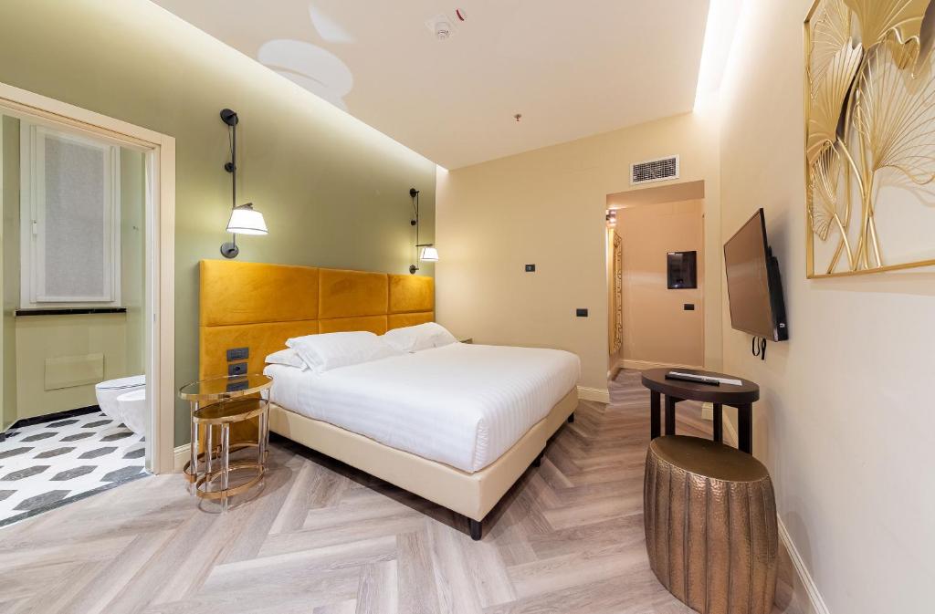 Postel nebo postele na pokoji v ubytování Hotel Astoria