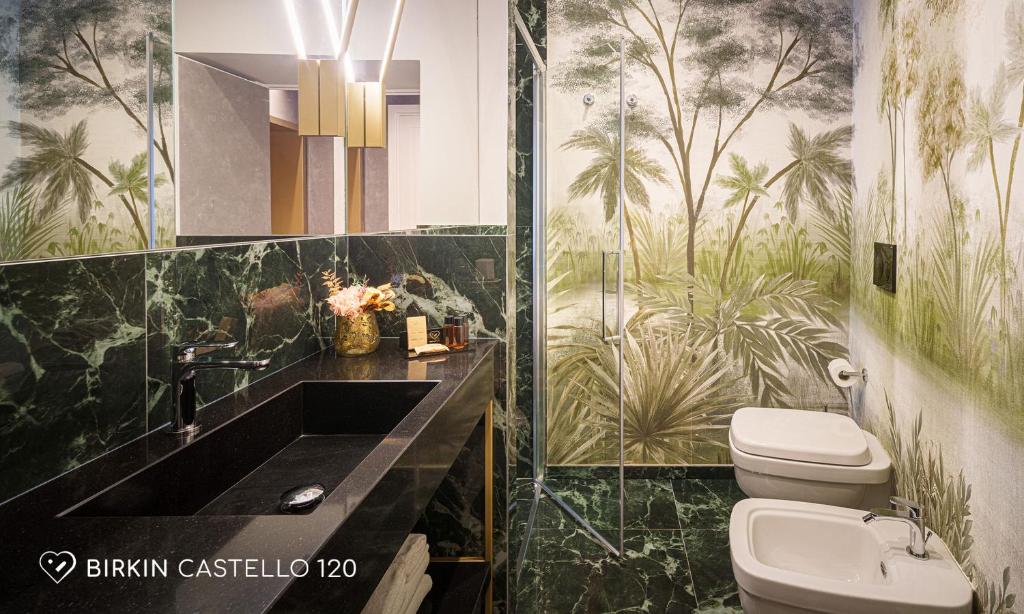 a bathroom with a sink and a toilet at Albergo Diffuso Birkin Castello in Cagliari