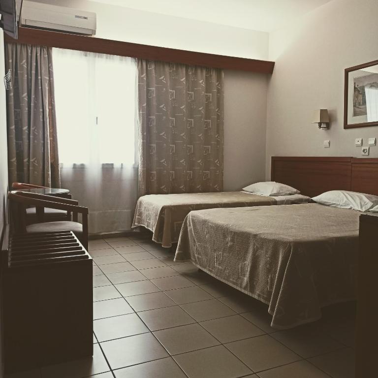 Postel nebo postele na pokoji v ubytování Hotel Solomou Athens