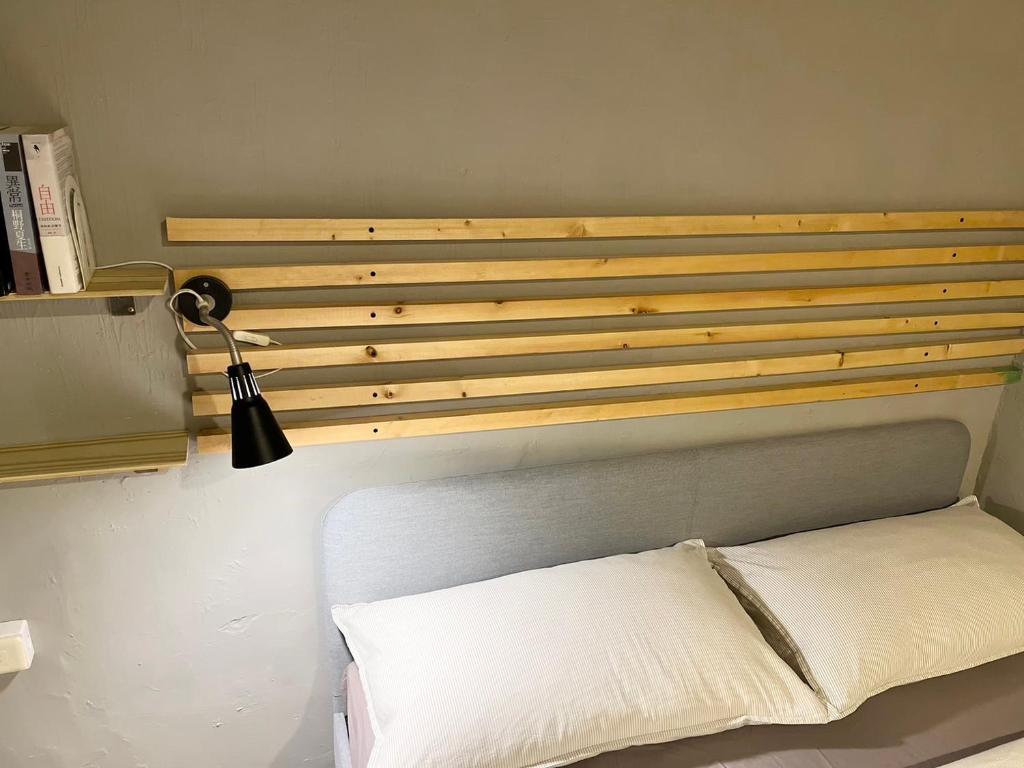 Postel nebo postele na pokoji v ubytování Ruifang Yi Hostel