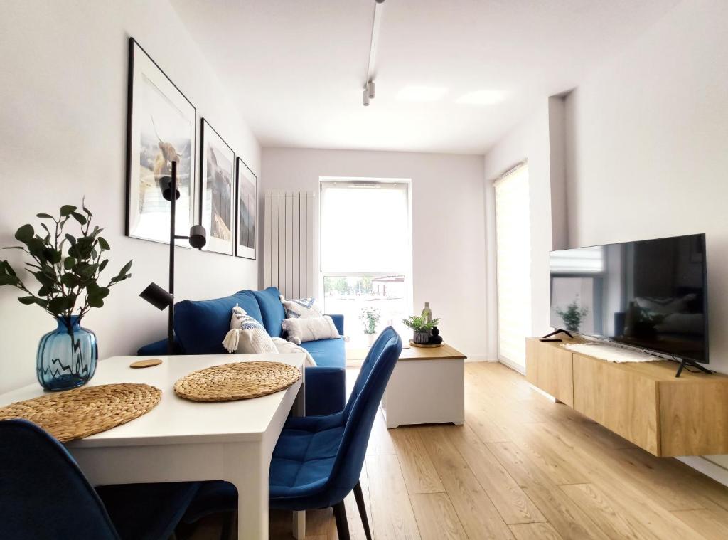 Televízia a/alebo spoločenská miestnosť v ubytovaní Mogilska 120D by Homeprime