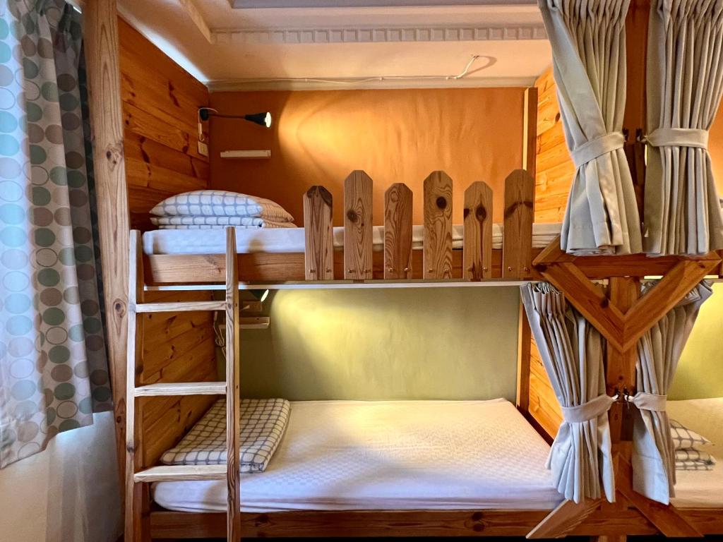 Postel nebo postele na pokoji v ubytování Gift Box Hostel