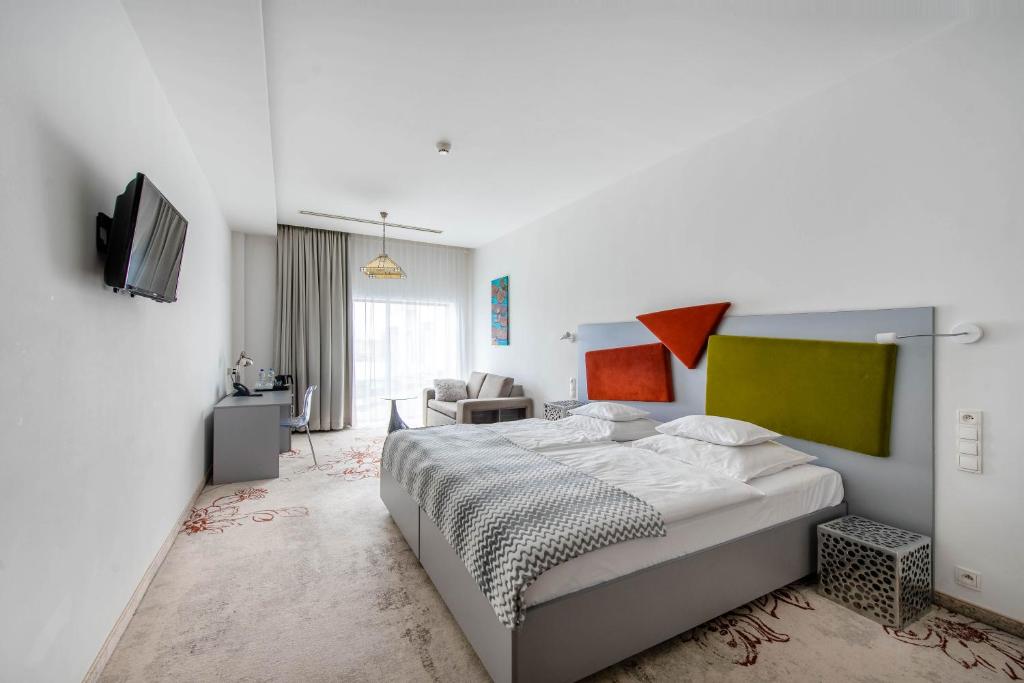 Posteľ alebo postele v izbe v ubytovaní Hotel Lenart