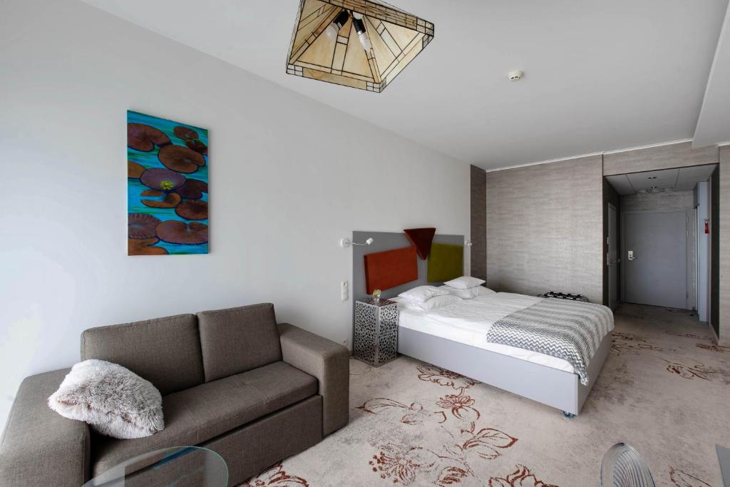 Posteľ alebo postele v izbe v ubytovaní Hotel Lenart