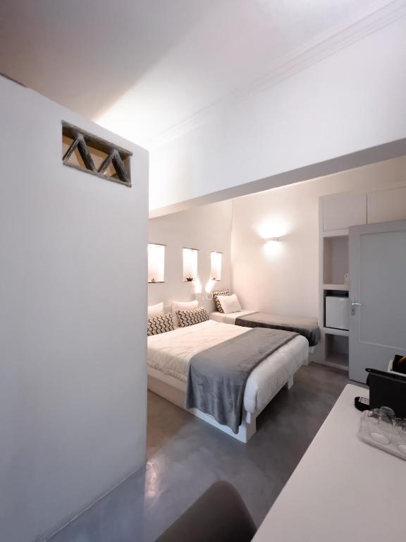 Voodi või voodid majutusasutuse Aggelikoula Rooms toas
