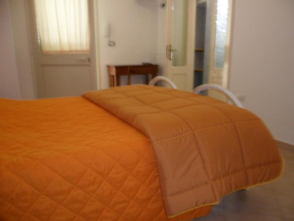 A bed or beds in a room at La Stanza Alternativa