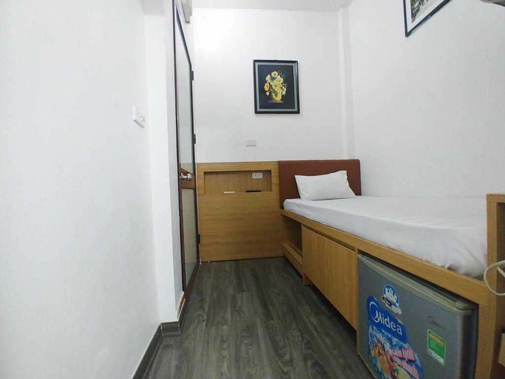 Postel nebo postele na pokoji v ubytování Hanoi Discovery Hotel