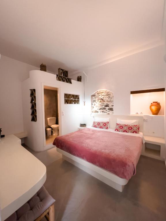Voodi või voodid majutusasutuse Aggelikoula Rooms toas