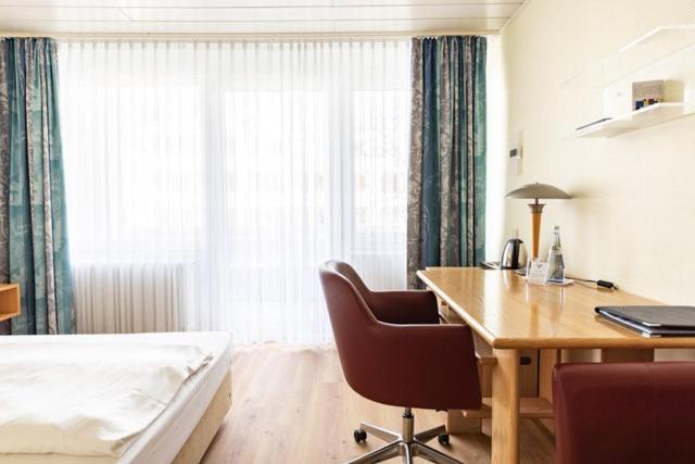 Postel nebo postele na pokoji v ubytování Hotel ISG Heidelberg