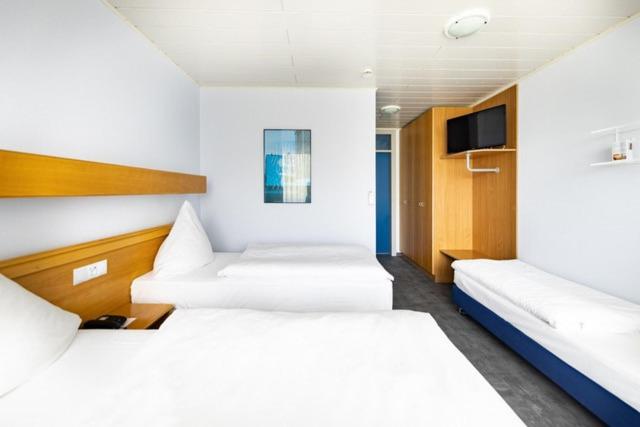 Postel nebo postele na pokoji v ubytování Hotel ISG Heidelberg