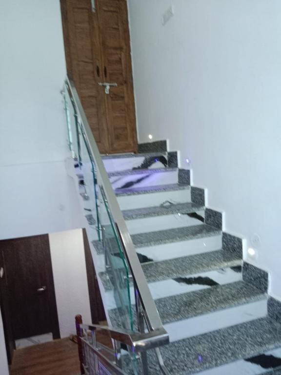 a staircase in a house with a bed on it at Gupta Residence. in Dhanbād