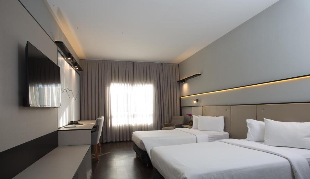Cama ou camas em um quarto em Transamerica Lagoa dos Ingleses