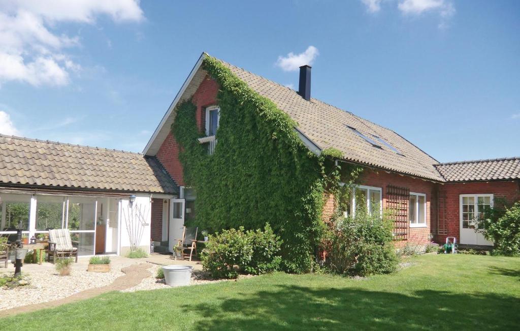 a house with ivy growing on the side of it at Stunning Home In Helsingborg With 4 Bedrooms And Wifi in Helsingborg