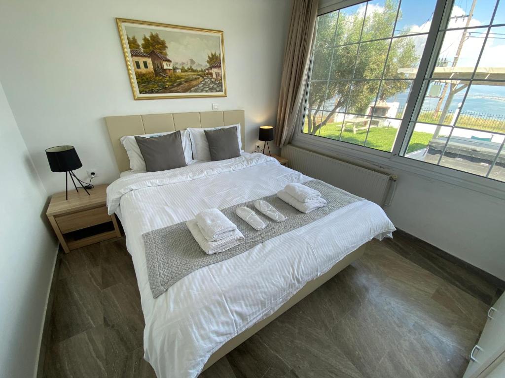 Łóżko lub łóżka w pokoju w obiekcie Villa Blue Apartments