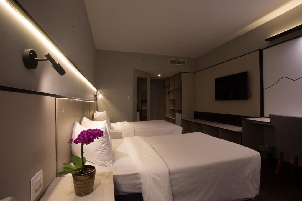 Cama ou camas em um quarto em Transamerica Lagoa dos Ingleses