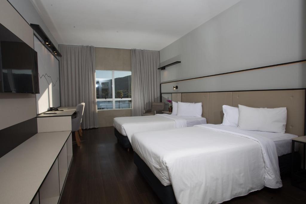 Cama ou camas em um quarto em Transamerica Lagoa dos Ingleses