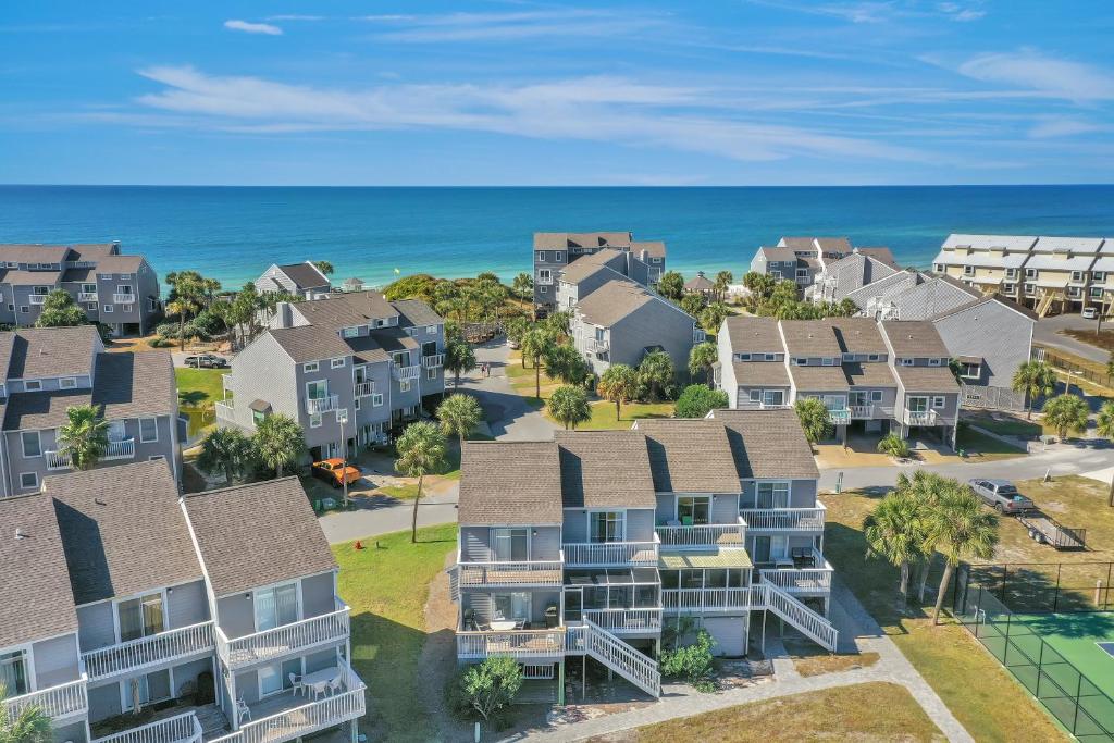 an aerial view of a residential neighborhood with houses and the ocean at Barrier Dunes 426 - 62 Beach House Too by Pristine Properties Vacation Rentals in Oak Grove