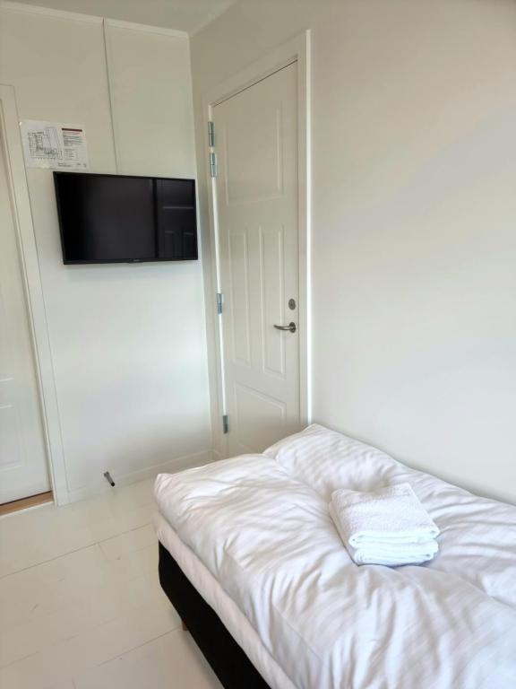 Postel nebo postele na pokoji v ubytování Skovsgård Hotel