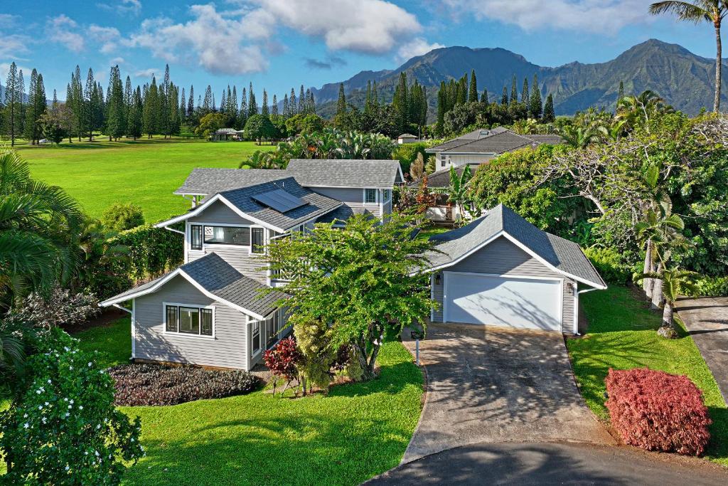 an aerial view of a house with mountains in the background at Kaiana Villa in Princeville