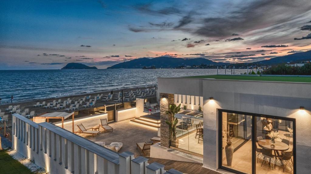a view of the ocean from the balcony of a building at Villa V Beach Villa, All Inclusive Board, by ZanteWize in Laganas