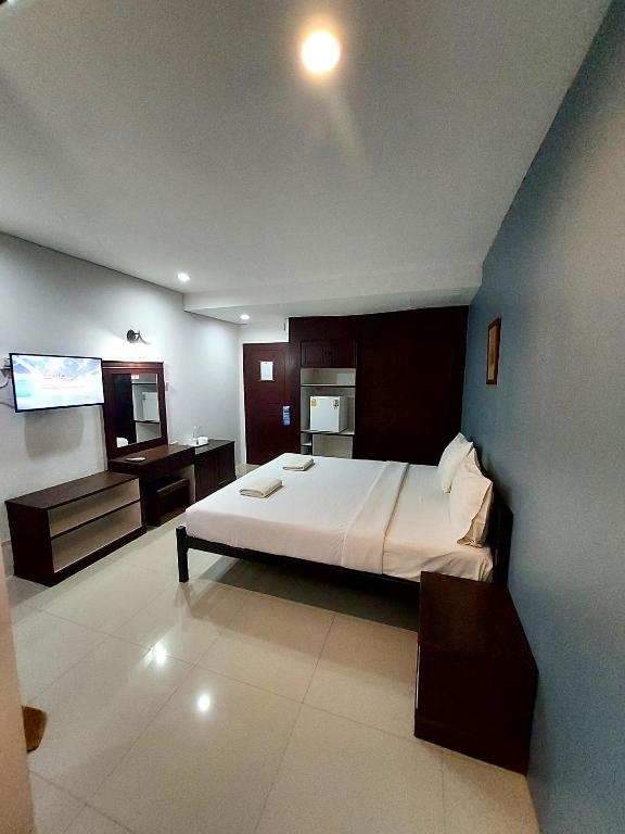 Postel nebo postele na pokoji v ubytování Traveller Inn Hotel