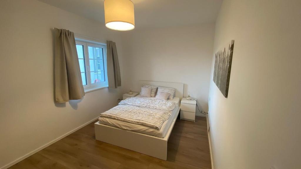 Postel nebo postele na pokoji v ubytování Ferienwohnung mit Garten