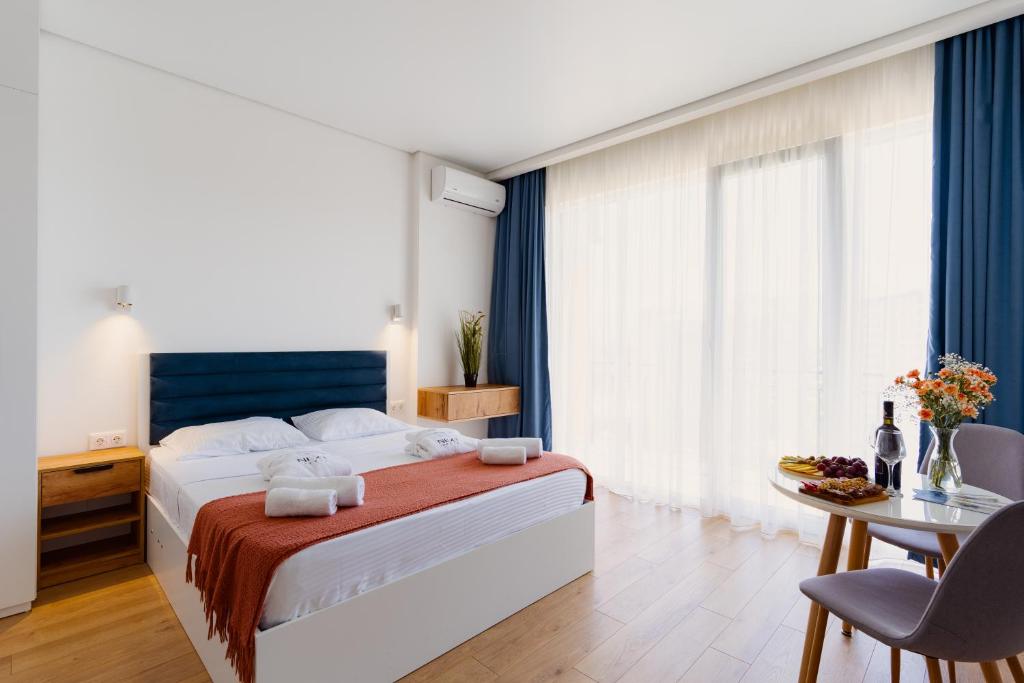 Ένα ή περισσότερα κρεβάτια σε δωμάτιο στο Next Orange Aparthotel OFFICIAL