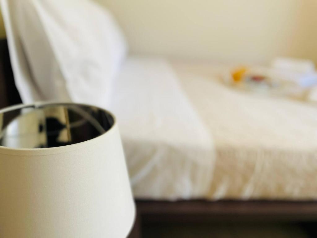Letto o letti in una camera di Cozy Nest - 2min To Beach, 6min Walk To Old Town